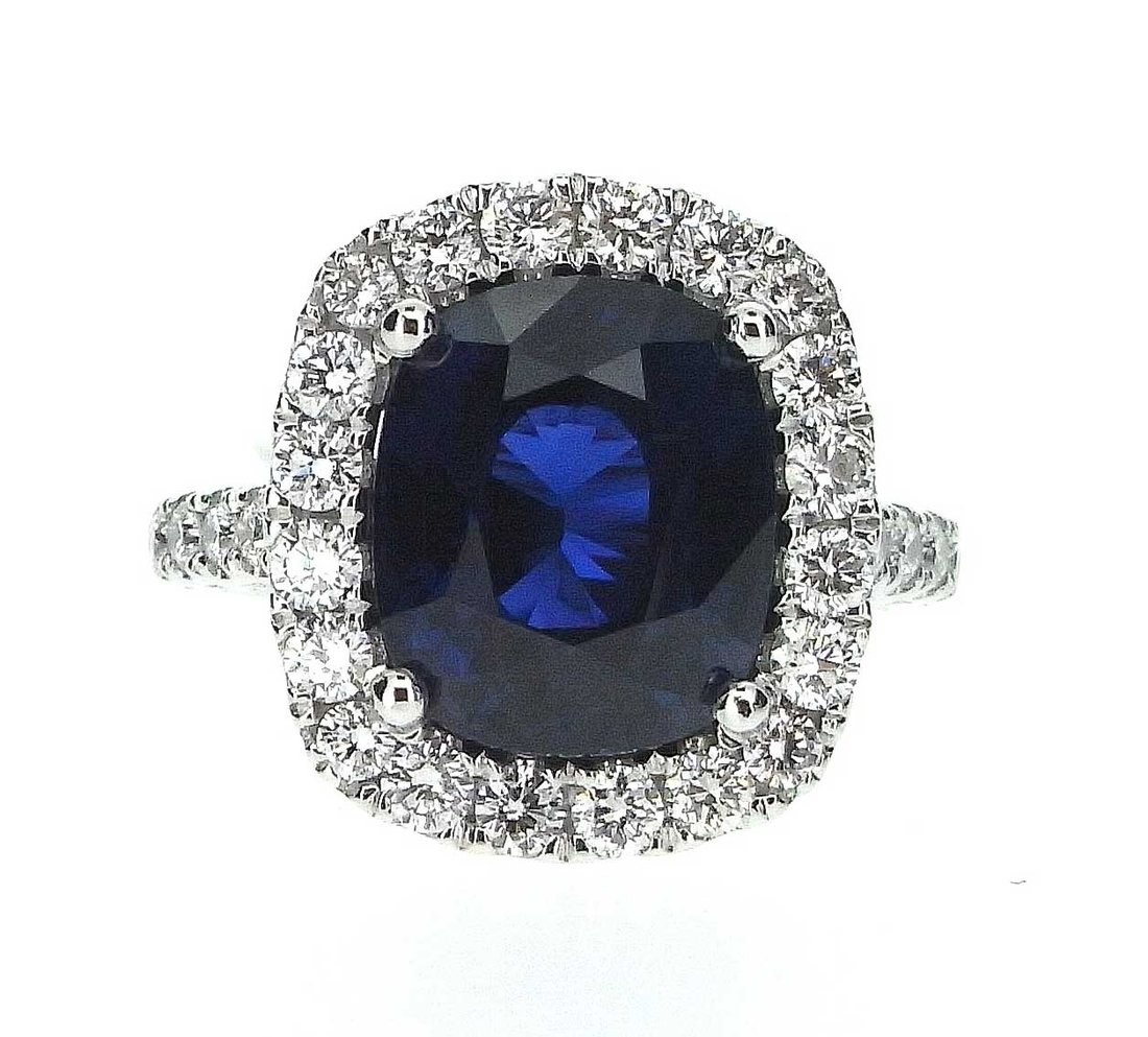 6.60ct blue sapphire and diamond cluster, made to commission.